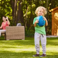 kid outside with ball